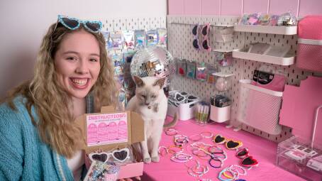 Hannah Murrells, pictured with her cat Frankie, has started an Etsy store selling Taylor Swift friendhship bracelet kits. Picture by Sitthixay Ditthavong