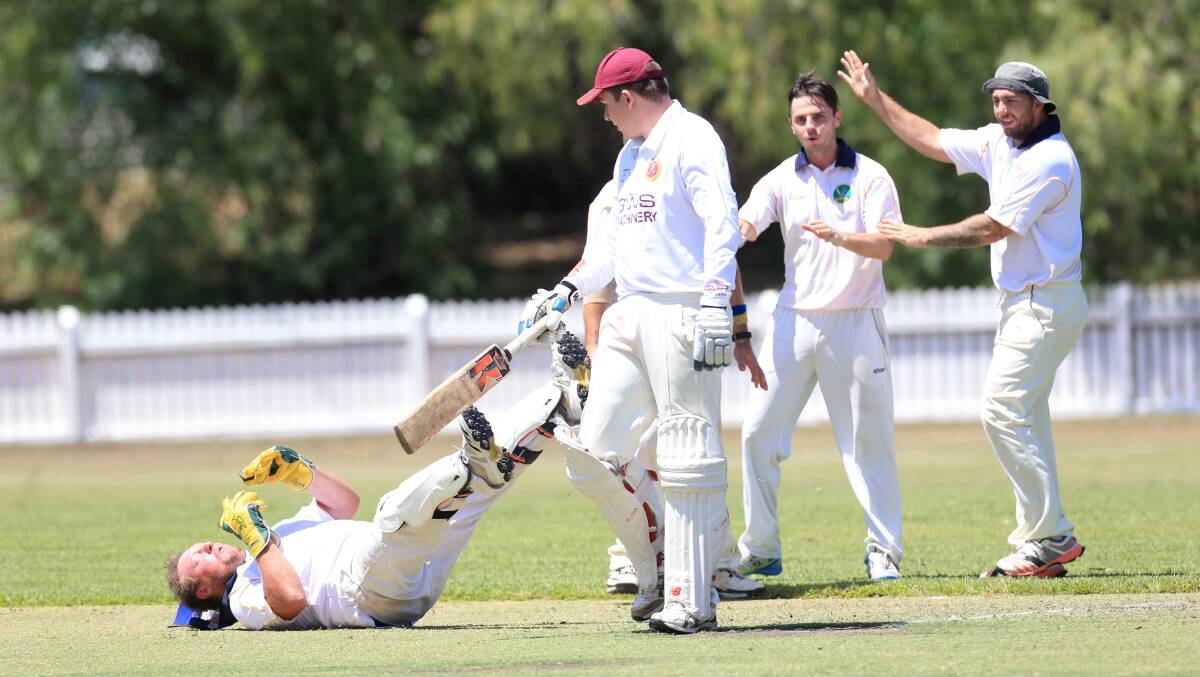 Riverstone keeper Daniel McLean is knocked to the ground after a collision with Freemans Reach batter Luke O'Hare during the HDCA first grade match at McQuade Oval Windsor. Picture: Geoff Jones