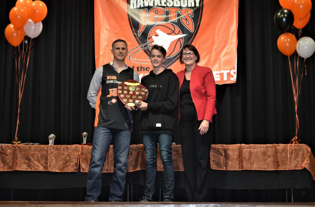 All smiles: Dan Stephenson receives his Junior Association Award from chairperson of Hawkesbury and District Basketball Association Maurice Mantovani and Macquarie MP Susan Templeman. 