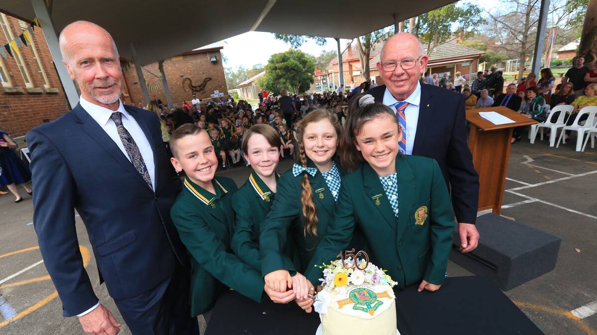 Celebration: Mike Watson, Cassidy Grima, Jasmine Solah, Jackson King, Jacob Simmons and Ian Thom cut the cake with the foundation trowel. Picture: Geoff Jones.