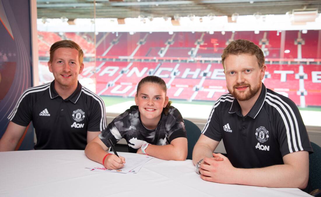 Signed: Savannah Murray signs her new contract. Picture: Manchester United FC.