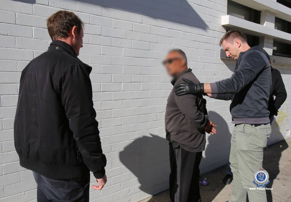 Arrest: The man is arrested over the two alleged robberies. Picture: NSW Police.