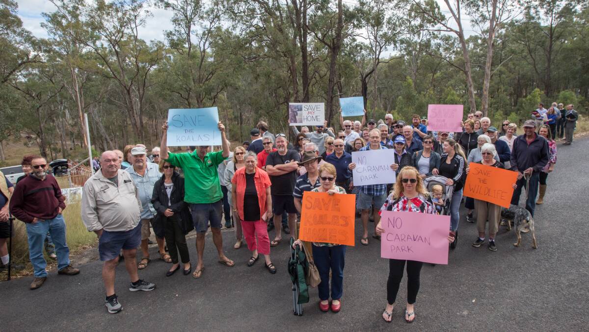 Hearing: More than 100 local residents were present at Wattle Crescent, Glossodia, when the NSW Land and Environment Court held a visit to the site of a proposed caravan park. Picture: Geoff Jones.