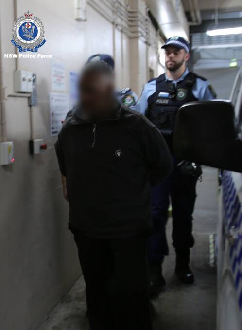 The man is taken into custody by police. Picture: NSW police.