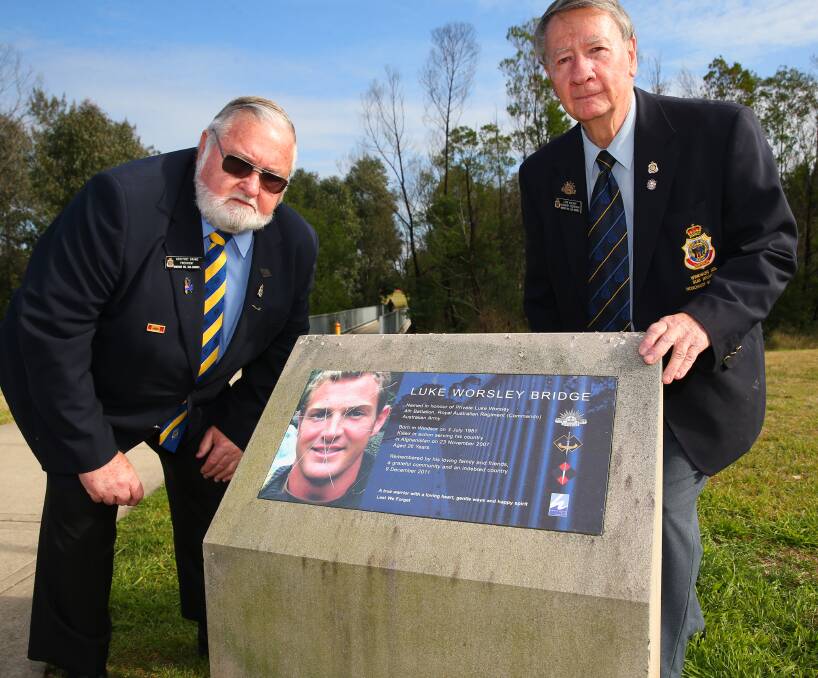 Vandalised: Windsor RSL Sub-Branch President Geoff Brand and Secretary Leon Walker at the Howe Park Windsor Memorial for Luke Worsley which has been desecrated. Picture: Geoff Jones.
