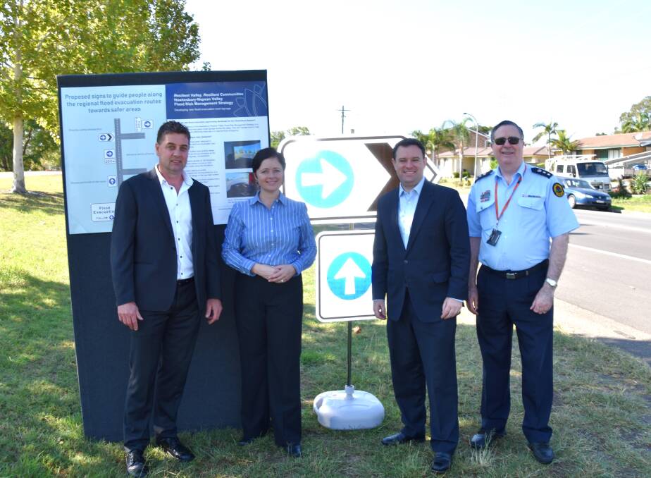 RMS project manager Paul Leonard, Mulgoa MP Tanya Davies, Western Sydney Minister Stuart Ayres, and SES Sydney Western Regional Controller Peter Cinque with some of the new signage.