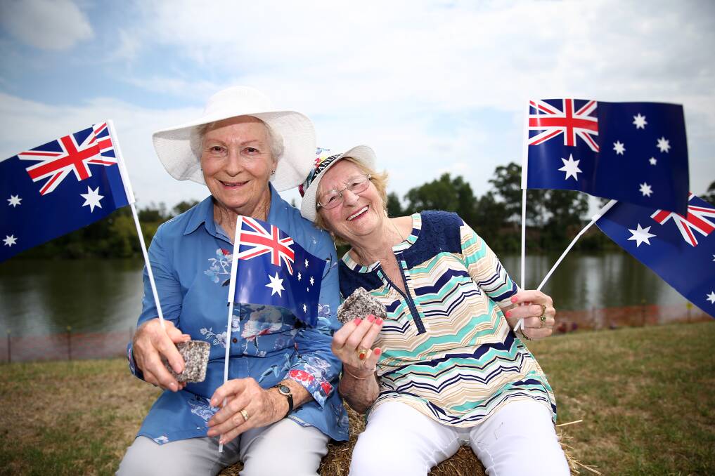 Celebrations: Diana Fisher and Thodora Werle celebrate Australia Day on the banks of the Hawkesbury River at Governor Phillip Park this year. Picture: Geoff Jones.
