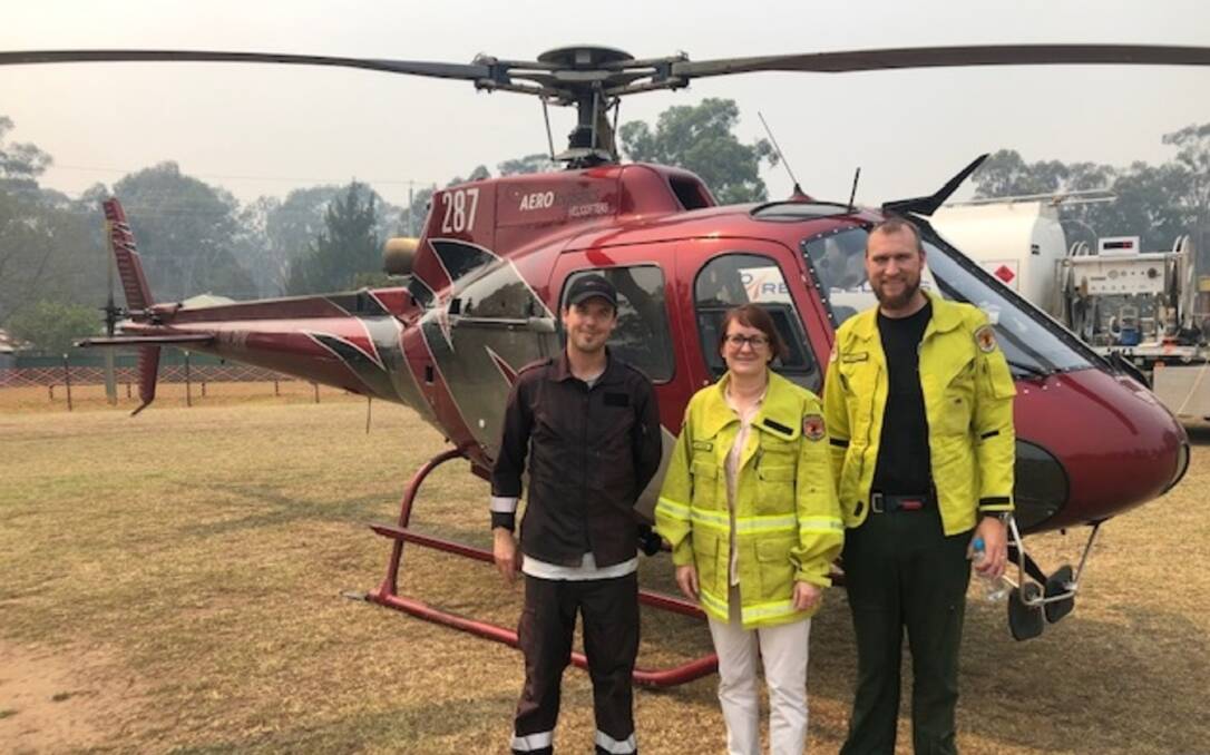 Bushfires: Susan Templeman accepted an invite to view the work being done on the Gospers Mountain fire last month. Also pictured is Blair from Aerologistics Helicopters Newcastle and Levi from NSW NPWS. Picture: Supplied.