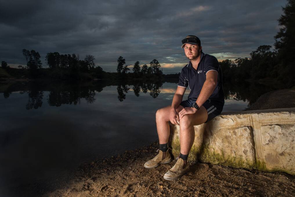 "Didn't think twice": Brad Johnston at the site where he rescued an elderly man whose car had crashed into the Hawkesbury River at Pitt Town. Picture: Geoff Jones.