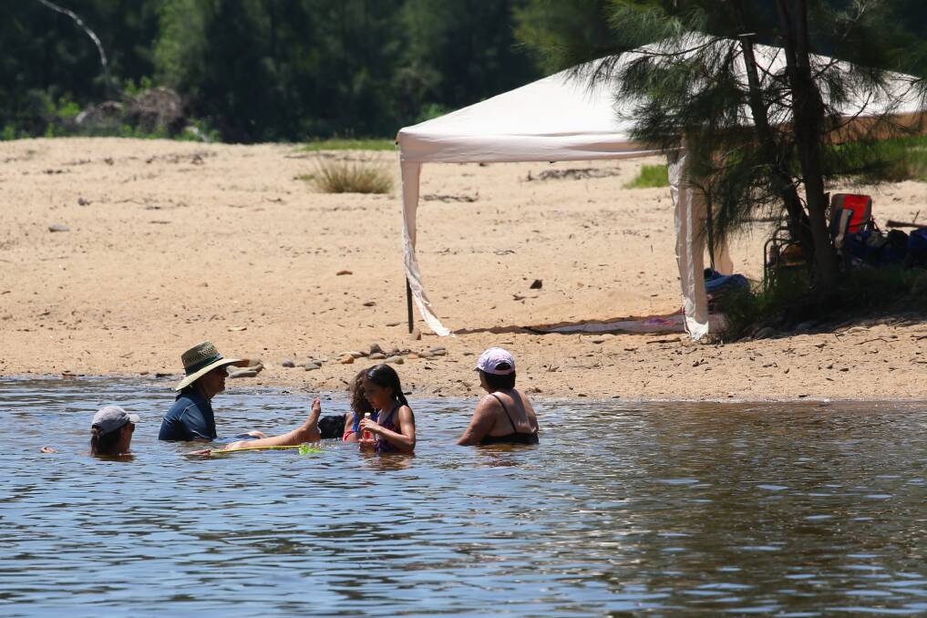 Hot weather: Locals cool off at Navua Reserve Grose Wold during hot weather. Picture: Geoff Jones.