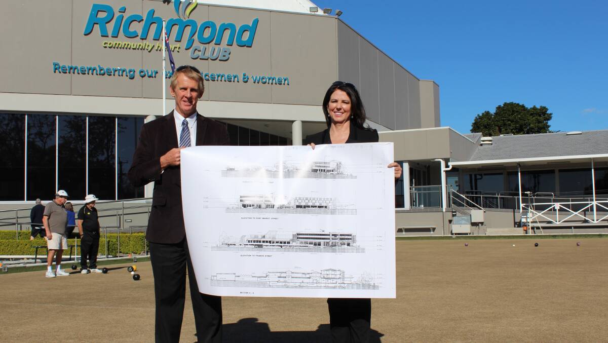 Flashback: Chairman Geoff Luscombe and Group CEO Kimberley Talbot with a 1995 version of the plans, on the site where the hotel will go. An operator for the hotel has now been announced.