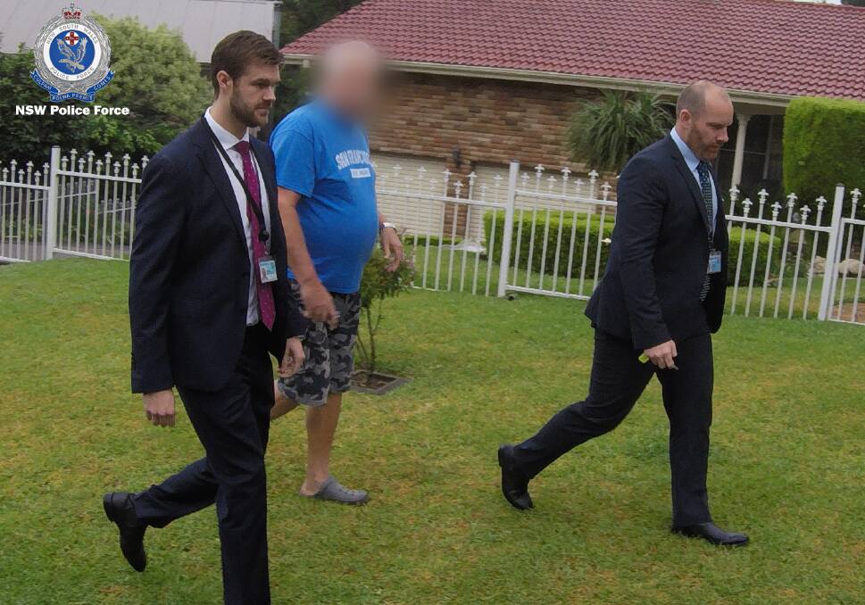 The man is arrested by strike force detectives yesterday. Picture: NSW Police.