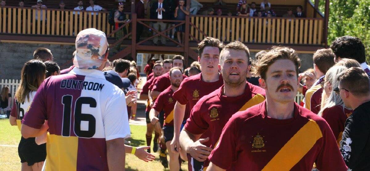 Inter-college rivalry: WSU supporters cheer on PJ Cartwright (right), Matt Popple (centre) and the rest of HAC Rugby at Duntroon 2016. Picture: Larissa Baker. 