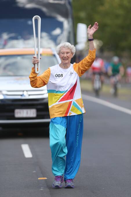 Achievement: Heather Lee, pictured here carry the Queen's Baton in February in the lead-up to the Commonweath Games. Picture: Geoff Jones.