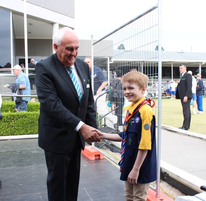 Richmond Club Group Vice Chairman Garry Watterson shakes Lawson's hand after the service.