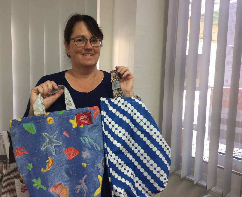 Upcycling: Sharon Grech of Boomerang Bags Hawkesbury with a couple of the group's creations.