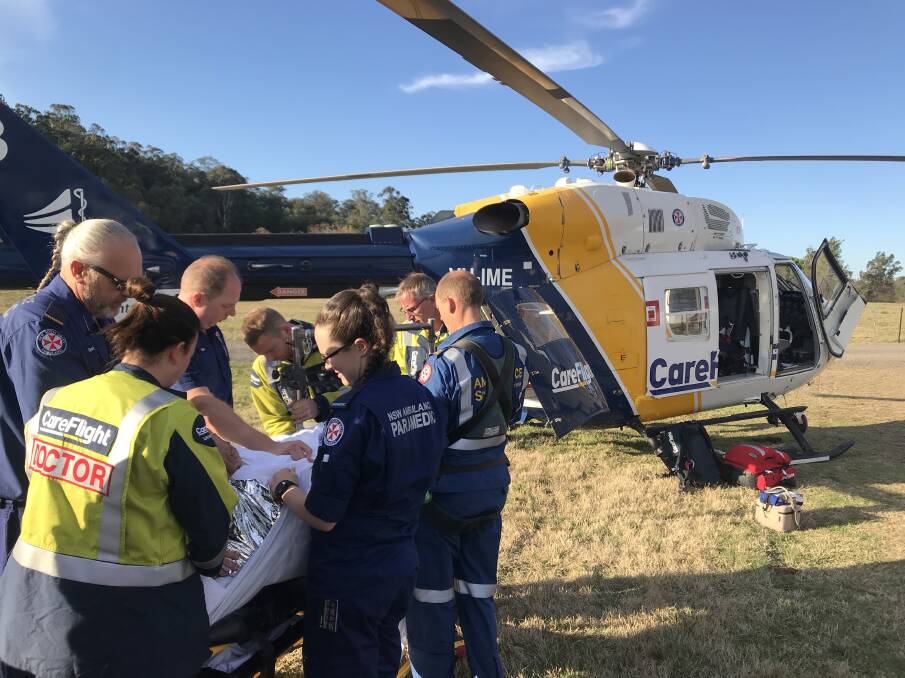 Flown to hospital: The man is stabilised at the scene before being flown to hospital on Monday. Picture: CareFlight.