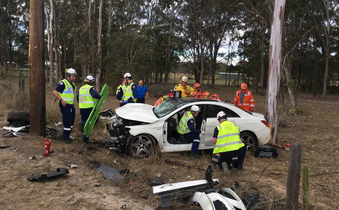 Crash: Emergency services at the scene of the crash at Pitt Town. Pictures: CareFlight.