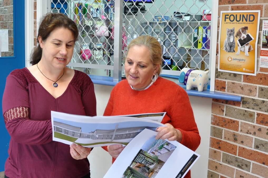 Plans: Cr Danielle Wheeler and Deputy Mayor Mary Lyons-Buckett look over the new plans for Hawkesbury Companion Animal Shelter. Picture: Supplied.