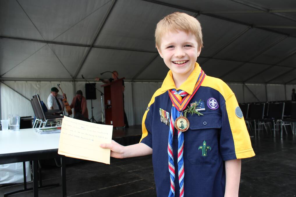 Anzac spirit: Nine-year-old Lawson Doyle of 1st Hawkesbury Scouts with the copy of his neatly handwritten speech after the service.