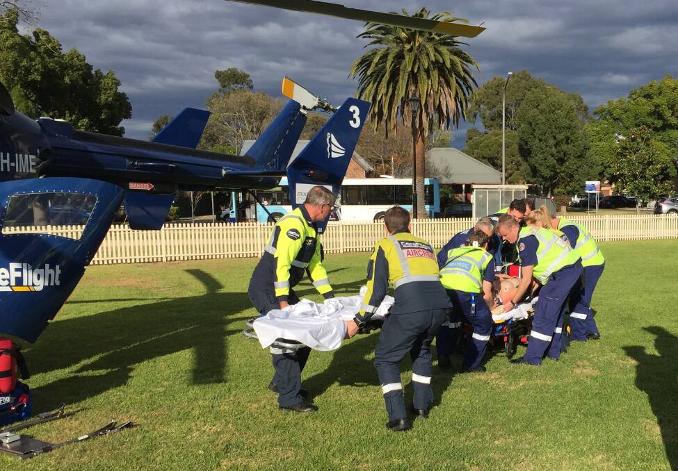 The man is taken to the CareFlight helicopter for transportation to hospital. Picture: CareFlight.