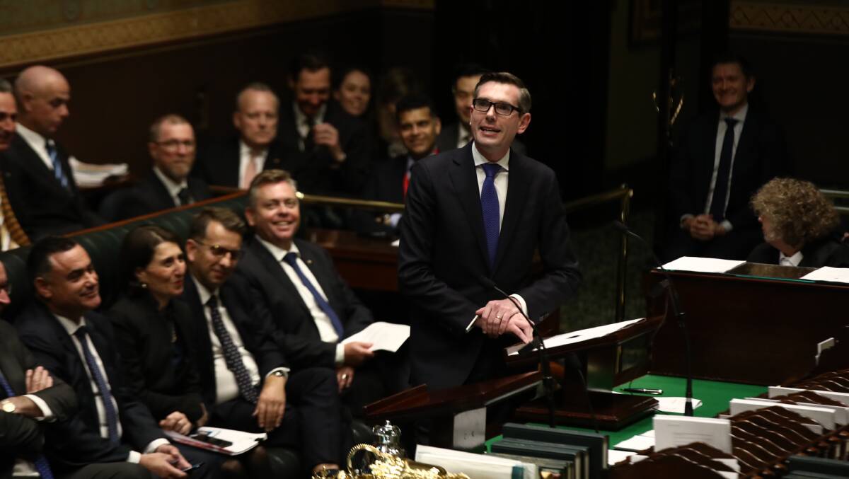 NSW Treasurer and Hawkesbury MP Dominic Perrottet hands down his State Budget in the NSW Parliament on June 19. Photo: Dominic Lorrimer.