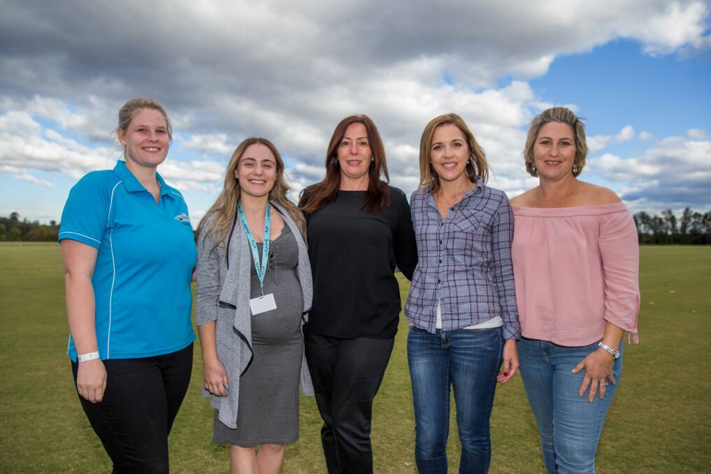 Donation: Caitlin Lyons and Lauren Northen from Blue Datto, Glenis Wright from the Hawkesbury Gazette, Kym Burton from Pink Finns and Melissa Chapman. Picture: Geoff Jones