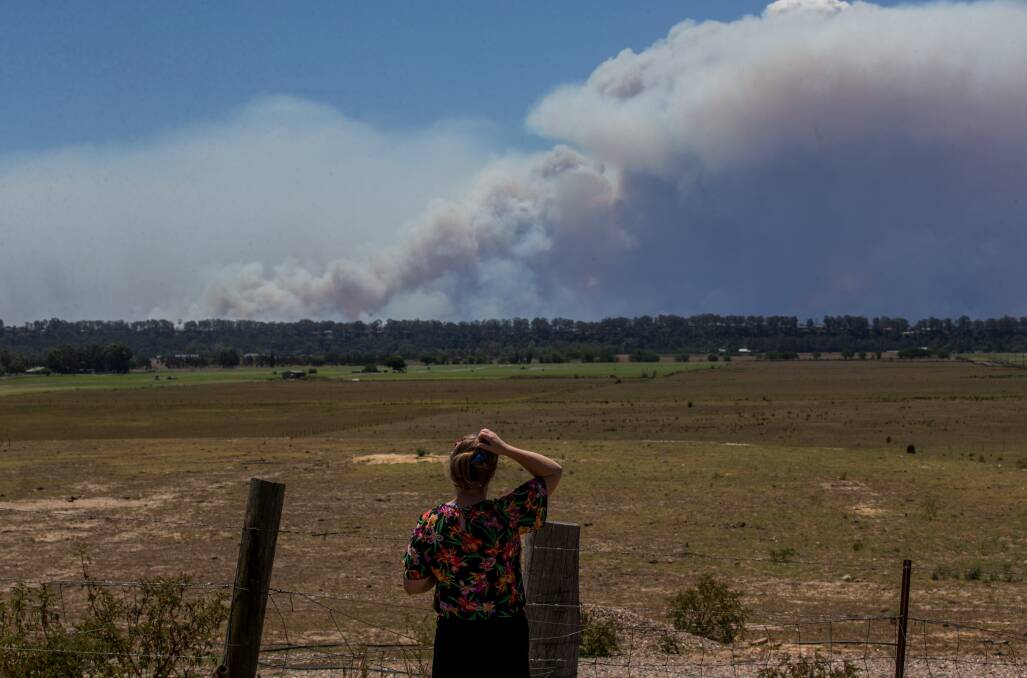Increased activity: The view over the Richmond Lowlands looking towards the Gospers Mountain fire on Tuesday afternoon. Picture: Geoff Jones.