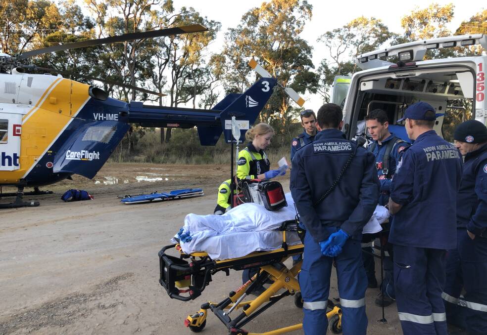 Scene: the dirt bike rider is treated at the scene of the collision near Londonderry. Picture: CareFlight.