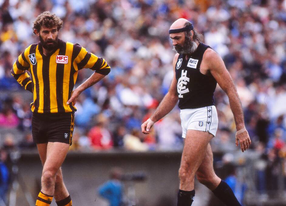 Carlton's Bruce Doull (right) with Hawthorn's Michael Tuck during a match in August, 1990. Photo: Getty Images