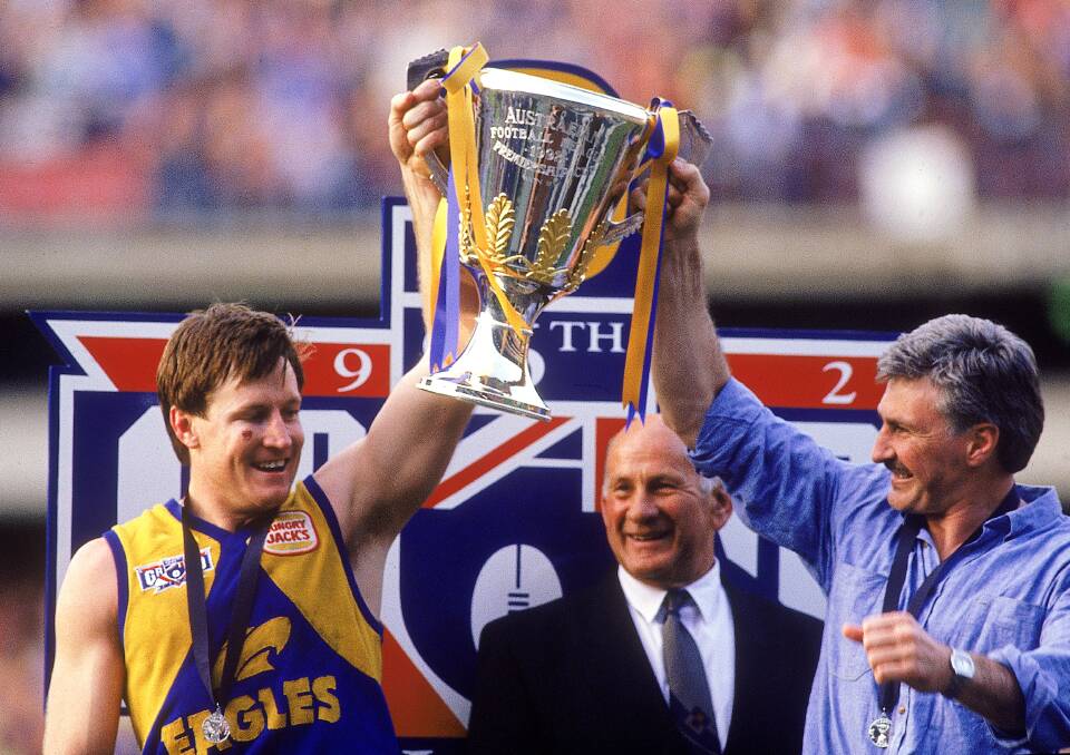 Eagles' John Worsfold and coach Mick Malthouse hold aloft the 1992 premiership trophy after beating Geelong in the AFL Grand Final. Photo: Tony Feder/Getty Images