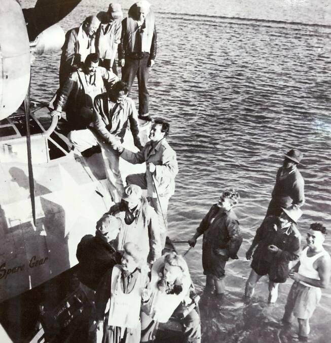  Bob Hope descends into the fishing boat. Photo: Camden Haven Historical Museum.