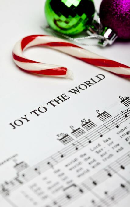 Christmas carols: Caroling is a great way to celebrate Christmas with everyone's favourites being sung at Carols by Candlelight or in church. Photo: Shutterstock.