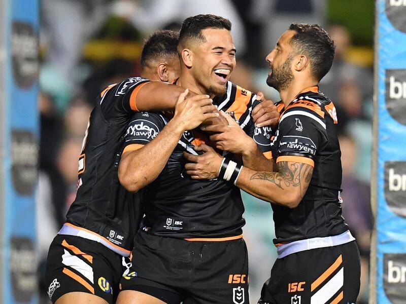Esan Marsters (centre) has been released by the Tigers and is set to join the Cowboys.