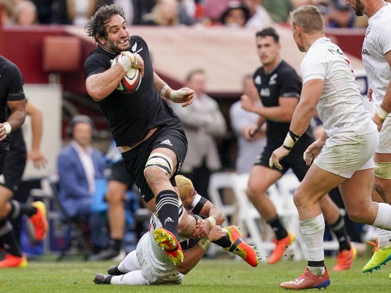 New Zealand captain Sam Whitelock is tackled by the United States' Nate Augspurger at FedEx Field.