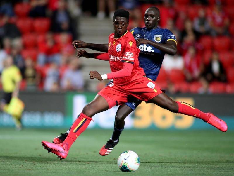 United's Mohamed Toure (l) became the youngest ever A-League scorer at 15 against the Mariners.