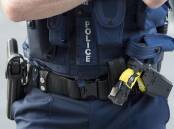 NSW may look at attaching GPS trackers to police guns. (Dave Hunt/AAP PHOTOS)