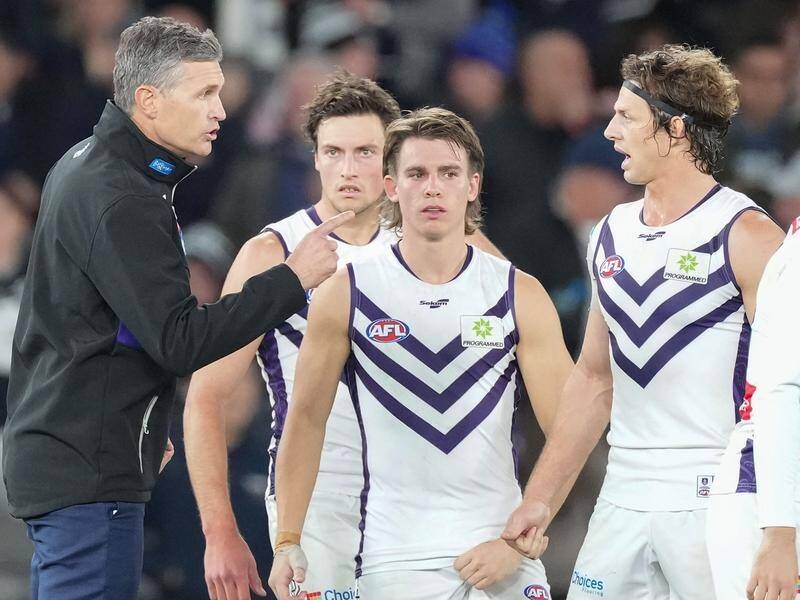Justin Longmuir (l) is backing Nat Fyfe (r) and the rest of the midfielders to improve against Port.