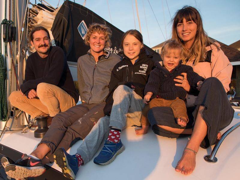 Greta Thunberg has sailed with Australian couple Riley Whitelum (L) and Elayna Carausu (R).