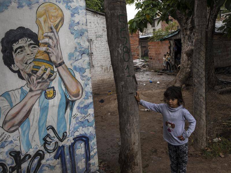 A mural depicting the late Diego Maradona near the Buenos Aires cemetery where he's buried.