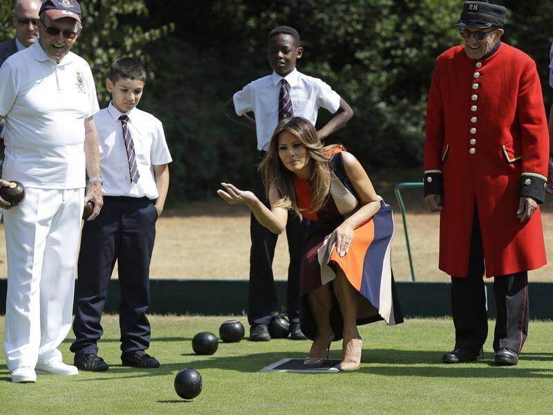 US First Lady Melania Trump tries her hand at lawn bowls during a visit to Royal Hospital Chelsea.