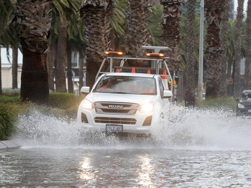 WA was battered by damaging winds and heavy rain in what the weather bureau said was a "rare event".
