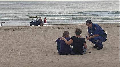 A woman in her 60s has died after being taken by a shark on the NSW south coast, leaving fellow swimmers "shocked and horrified".