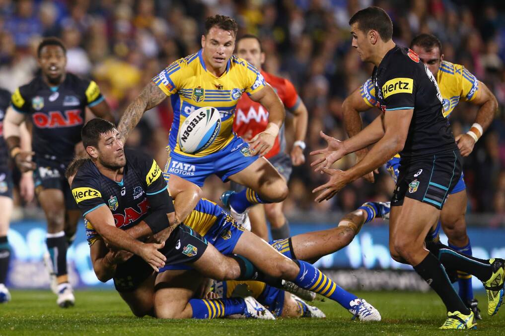 SYDNEY, AUSTRALIA - MAY 29:  Sam McKendry of the Panthers gets a pass away as he is tackled during the round 12 NRL match between Penrith Panthers and the Parramatta Eels at Pepper Stadium on May 29, 2015 in Sydney, Australia.  (Photo by Mark Kolbe/Getty Images)