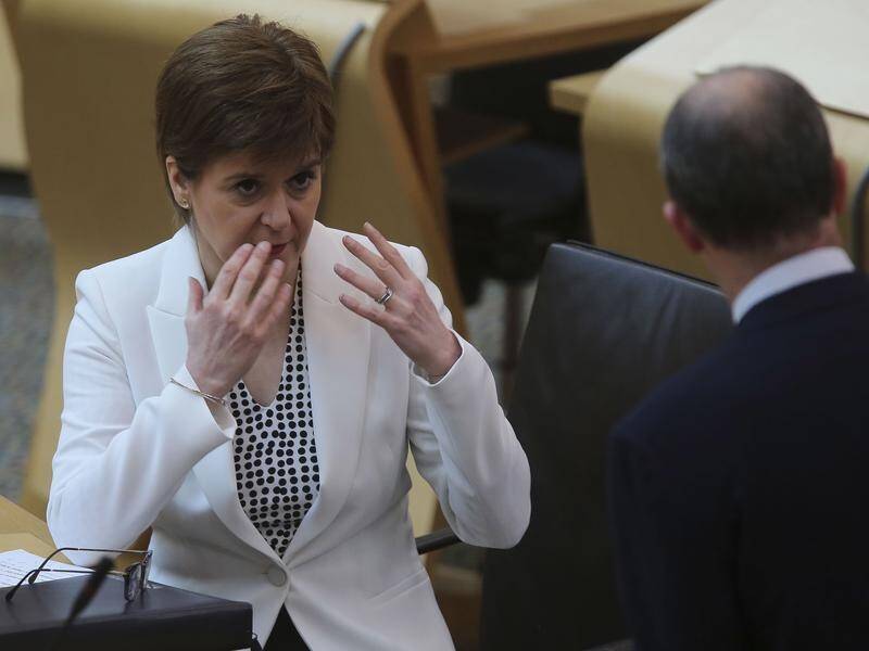 Scottish leader Nicola Sturgeon (L) has announced the first phase of lifting lockdown measures.
