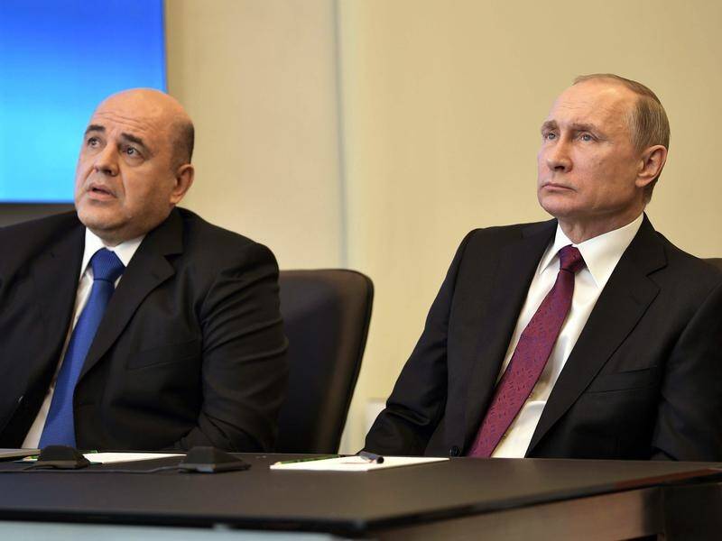 Head of Russia's Tax Service Mikhail Mishustin (L) has been named the country's new prime minister.