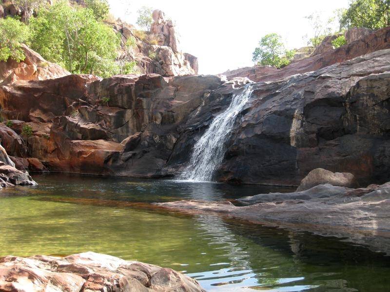 A criminal charge against Parks Australia was filed over Gunlom under the NT's Sacred Sites Act.