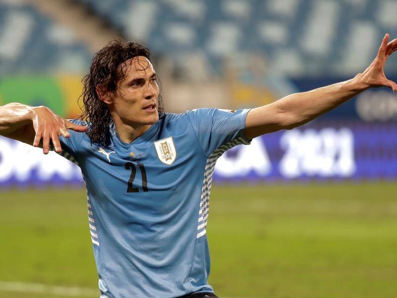 Edinson Cavani celebrates after his second goal sealed victory for Uruguay against Bolivia.