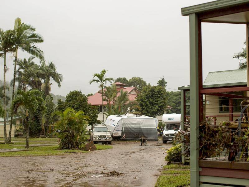 Ex-cyclone Nora is pushing south to Townsville after causing chaos with rain and flooding in Cairns.