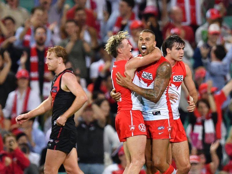 Lance Franklin kicked the clincher for Sydney to deny a fighting Essendon side.